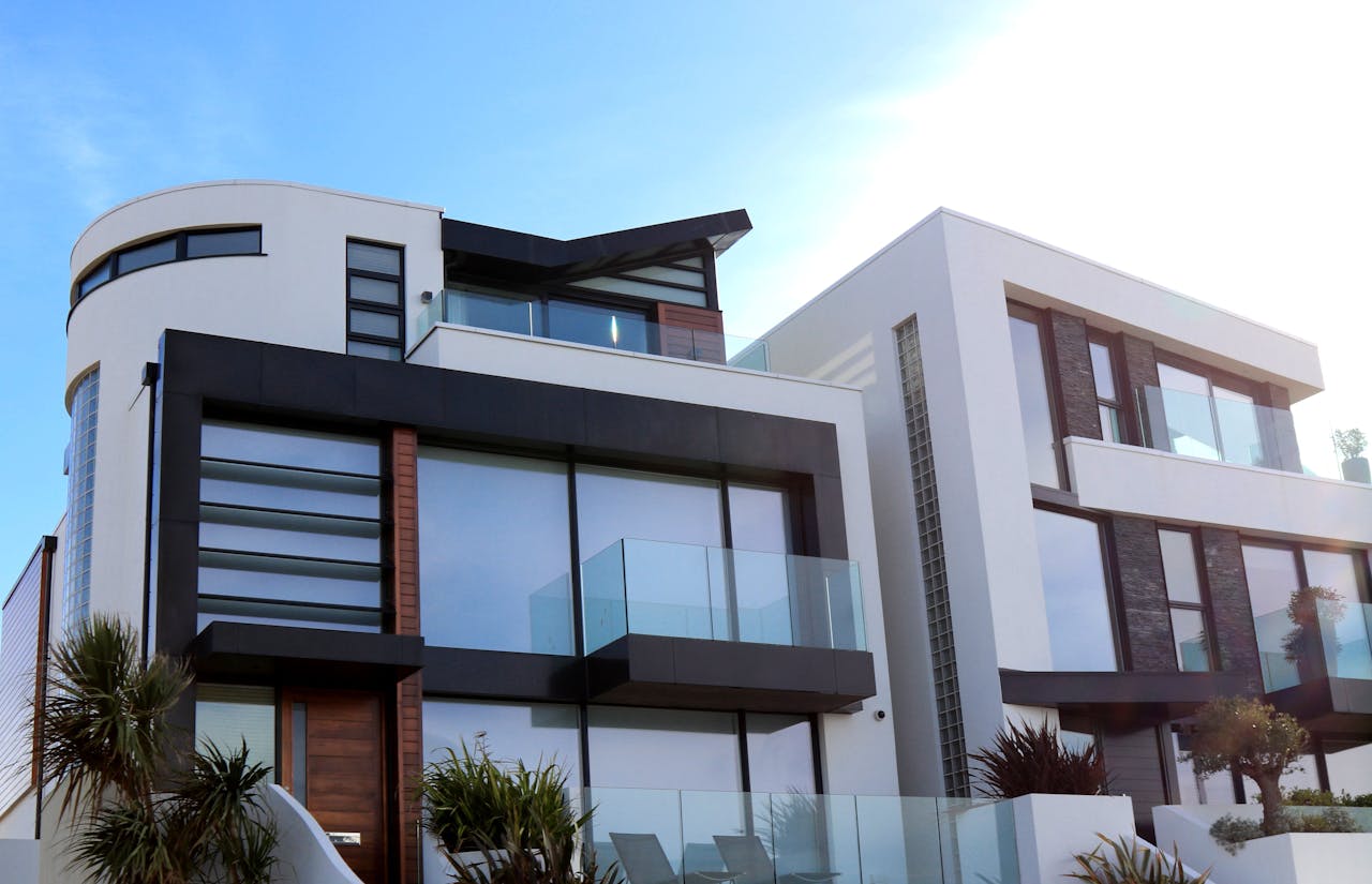 services-04 Contemporary luxury home with glass balconies in Poole, UK, showcasing modern architectural design.